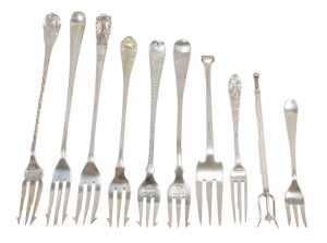 Ten pickle forks, to include a three pronged example with bright cut Old English pattern stem,...