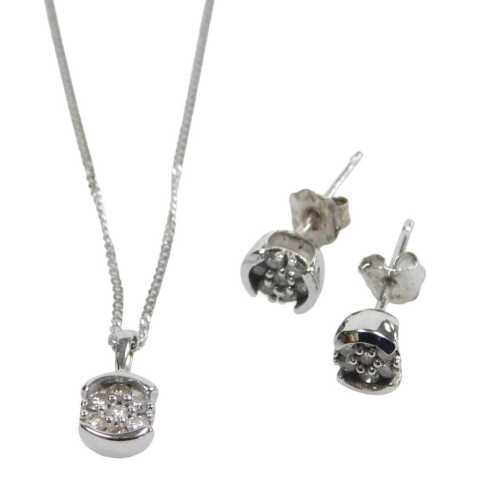 A 9ct white gold diamond pendant and earring set, the pendant set with arrangement of seven...