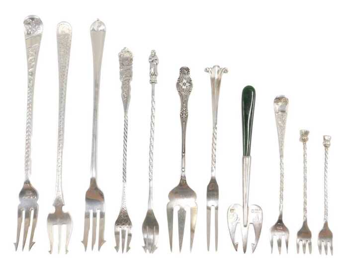 Eleven various silver pickle and serving forks, to include pronged example with entwined stem of...