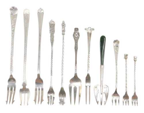 Eleven various silver pickle and serving forks, to include pronged example with entwined stem of...
