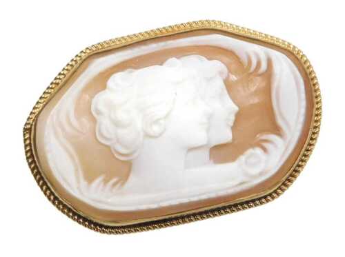 A 20thC shell cameo brooch, of oval shaped design, the cameo depicting two female heads, in a...