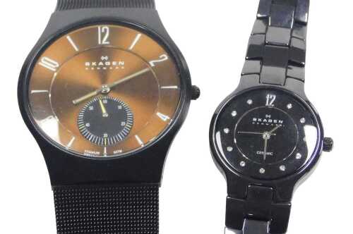 Two Skagen wristwatches, comprising a gent's brown dial and black steel cased wristwatch, 3.5cm...