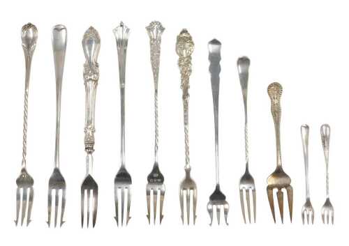 Eleven pickle and other serving forks, to include a small Old English pattern, with entwined...
