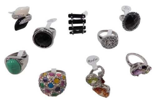 Nine dress rings, each stone set, varying from size 17 to 19, each on a white metal coloured...