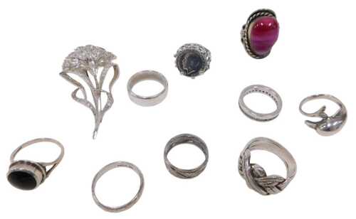 A quantity of silver jewellery, comprising a silver and white paste stone set floral brooch, 8cm...