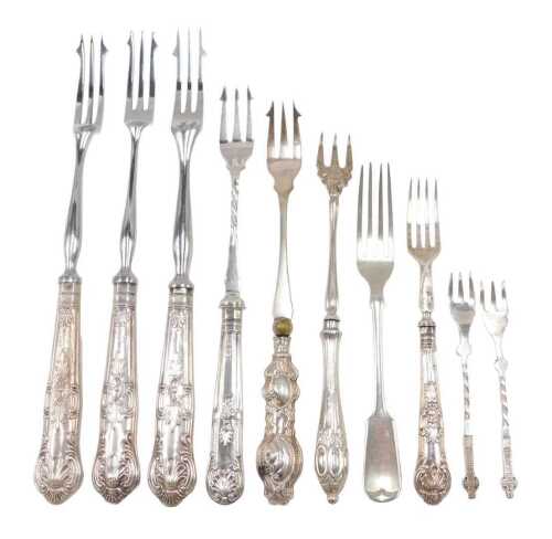 Ten silver and other pickle and serving forks, to include one with entwined handle with cross...