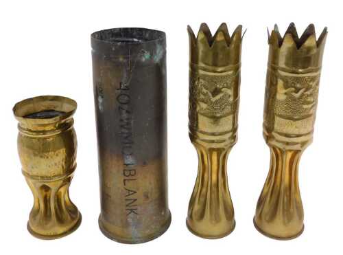 Trench art. A pair of intricately decorated French 1918 dated 75mm shell cases, together with a...