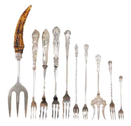 Ten silver and other pickle and serving forks, to include a horn handle example, with silver...