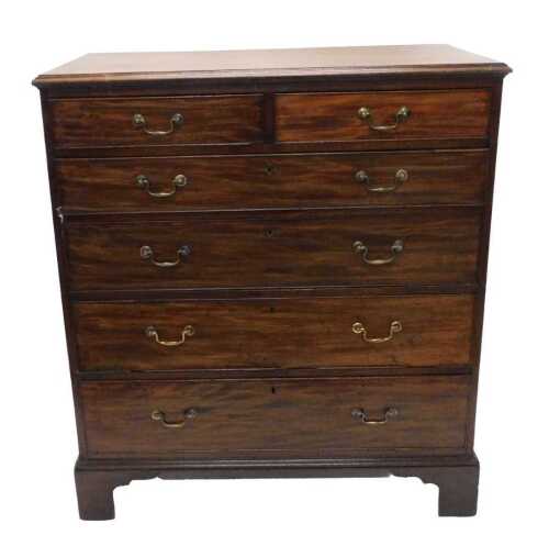 An early 19thC mahogany chest of drawers, with two short and four long drawers, each with swan...