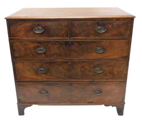 An early 19thC mahogany and flame mahogany chest of two short and three long drawers, each with...