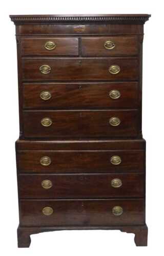 A George III mahogany chest on chest, the upper section with a dentil cornice, inlaid with a...