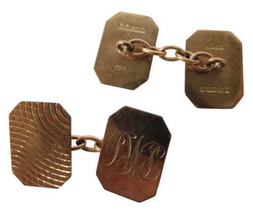A pair of 9ct gold cufflinks, each with part engine turned octagonal ends and plain chain...