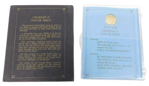 A replica 18ct gold Charles II touchpiece, with ship in full sail and St Michael and the dragon...