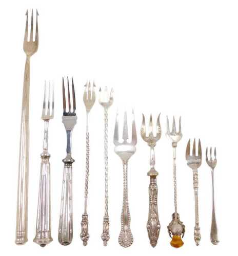 Ten silver and other pickle and serving forks, to include one with entwined stem and thistle and...