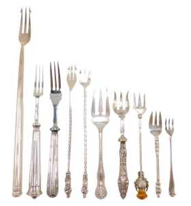 Ten silver and other pickle and serving forks, to include one with entwined stem and thistle and...
