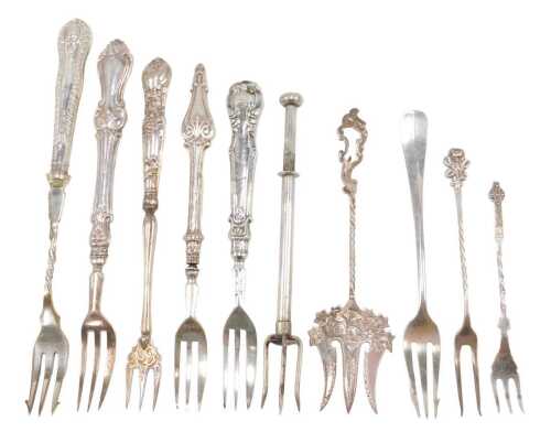 Ten silver and other pickle and serving forks, to include one with entwined stem and cross top,...
