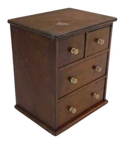 A miniature mahogany chest of two short and two long drawers, with turned bone handles, 17cm...