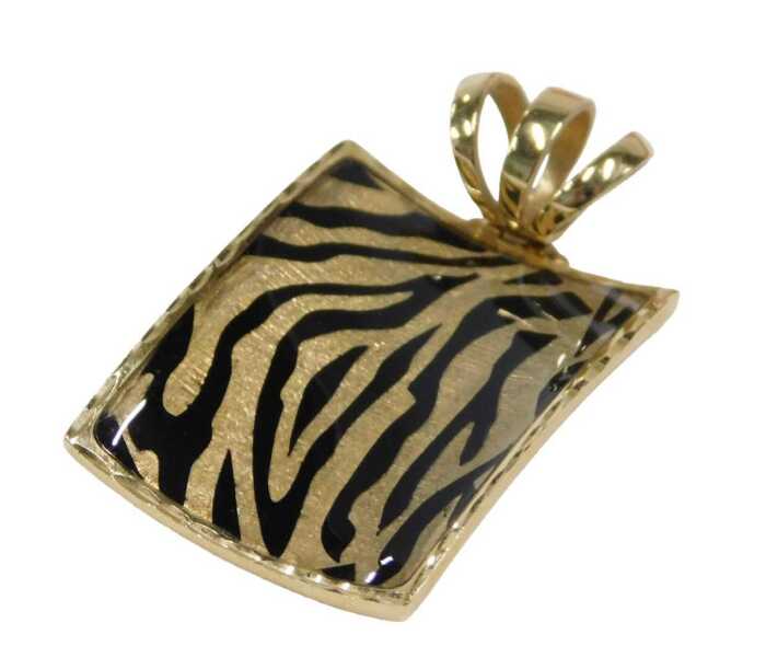 A drop pendant, of shaped rectangular form, tiger stripe, with elaborate three part clasp,...