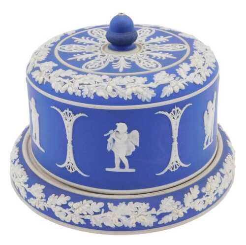 A 19thC dark blue Jasperware cheese bell on stand, decorated with flowers and classical figures,...