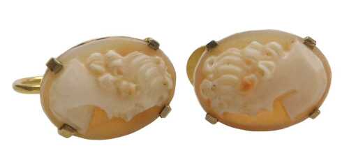A pair of shell cameo earrings, each depicting maiden, in a claw frame, on screw backs, yellow...