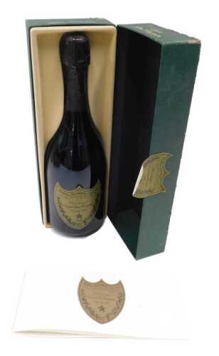 A bottle of Moet & Chandon Dom Perignon 1990 vintage Champagne, 750ml, in outer case, with...