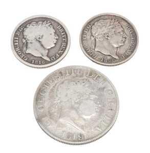 Coins. A George III half crown 1819, a shilling 1816, and a further shilling 1820. (3)
