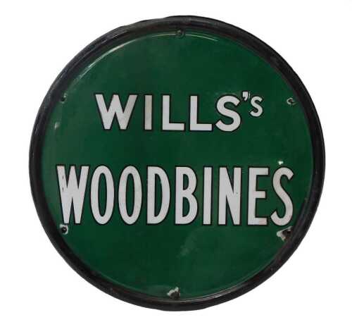 A Wills's Woodbines enamel double sided sign, of circular form, with white lettering against a...