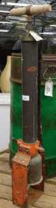 V - An early 20thC Eclipse iron pump, with cylindrical articulated wooden handle, partially painted...