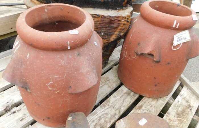 V - Two early 20thC chimney pot planters, each of cylindrical form, 43cm high. NB. VAT is payable on...