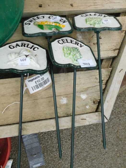 V - Various metal vegetable markers, including Garlic, Celery, etc., 35cm high. (4) NB. VAT is...