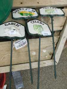 V - Various metal vegetable markers, including Garlic, Celery, etc., 35cm high. (4) NB. VAT is...