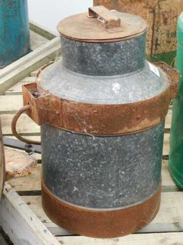 V - A small early 20thC milk churn, with swing handle and iron banding, with removable lid, of...