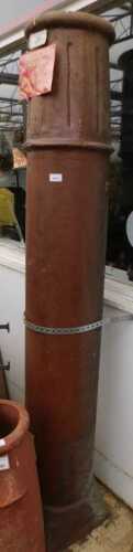V - An early 20thC chimney pot, of cylindrical form, with upper moulding, on a square base with...