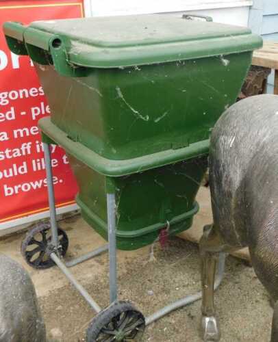 V - A Yorkshire Worms Co compost worm bin, in green, on a metal stand, with wheels, 98cm high. NB....
