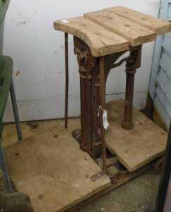 V - A 19thC wooden and cast iron scale, on a truckle base, with articulated slatted top and wooden...