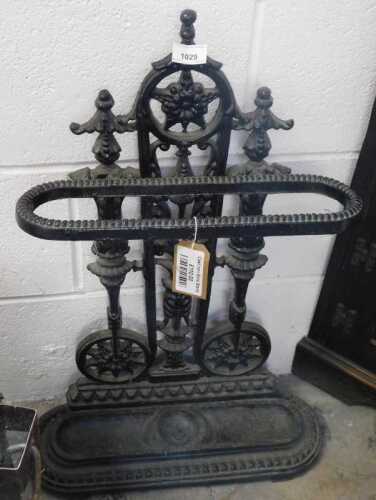 V - An early 20thC Coalbrookdale-style cast-iron stick stand, with an elaborate back, oval section,...
