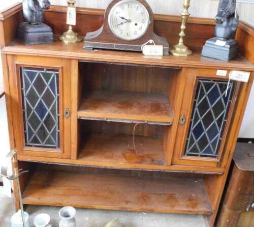 V - An early 20thC freestanding cabinet, with a three-part galleried top above an open shelf,...