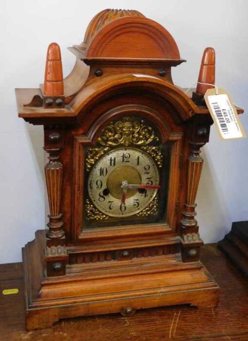V - A late 19thC walnut and pine cased mantel clock, the circular 11cm diameter Arabic dial with a...