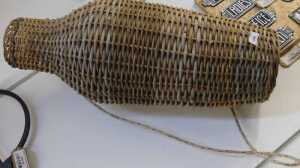 V - An early 20thC wicker eel basket, of shouldered form, with rope handle, 75cm high. NB. VAT is...