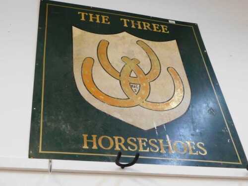 V - A vintage tin pub sign, The Three Horse Shoes, marked K&C 3, 108cm high. NB. VAT is payable on...