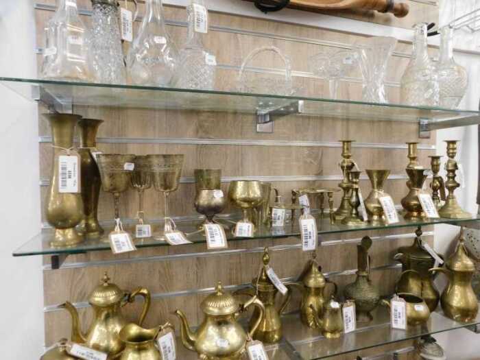 V - Various glassware, brassware, etc., a quantity of moulded pressed glass and other decanters,...