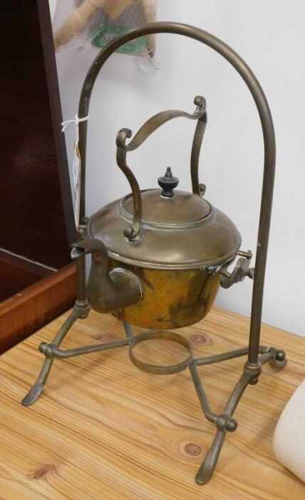 V - An early 20thC brass spirit kettle, on articulated stand, 40cm high. NB. VAT is payable on the...