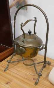 V - An early 20thC brass spirit kettle, on articulated stand, 40cm high. NB. VAT is payable on the...