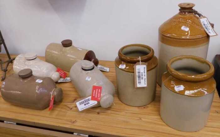 V - Various stoneware, a quantity of hot water bottles, a circular two coloured Pratt & Sparrow...