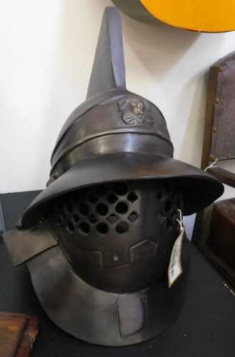 V - A replica medieval helmet, 43cm high. NB. VAT is payable on the hammer price. CAVEAT EMPTOR. All...