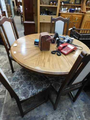 V - A 20thC oak dining table, of circular form, with rope twist outline, on heavy column,...