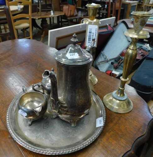 V - Various metalware, silver-plated three-piece tea set and tray, and two brass candlesticks, on...