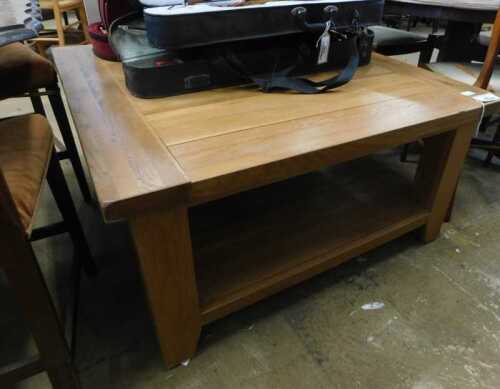 V - A 20thC slatted coffee table, of square form, with under tier, on shaped stiles, 51cm high,...