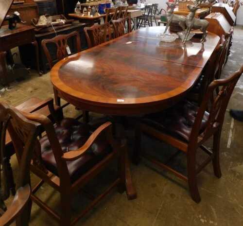 V - A dining room suite, comprising a twin pedestal D-end flame mahogany-finished table, with a wide...