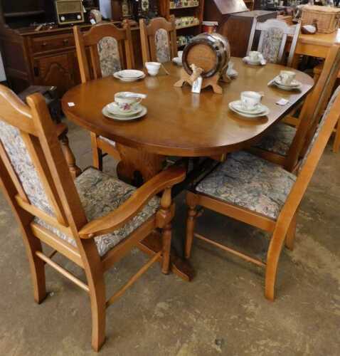V - A 20thC oak Old Charm style dining room suite, comprising D-end table and six (four plus two)...